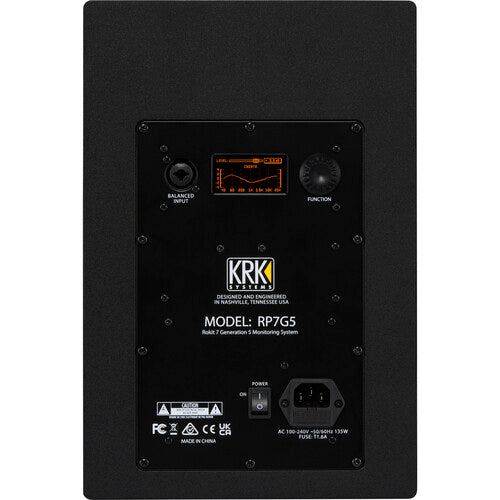 Panel trasero del KRK ROKIT 7 Gen 5 mostrando la pantalla LCD de control DSP y conexiones.